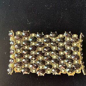 Stretchable Gold evil eye rhinestone designs with black stones.